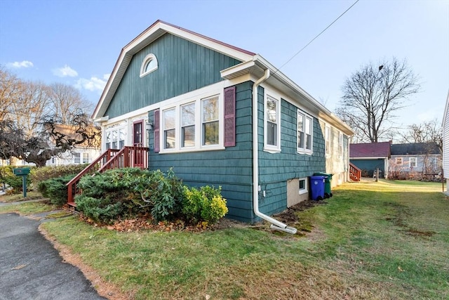 view of property exterior with a lawn