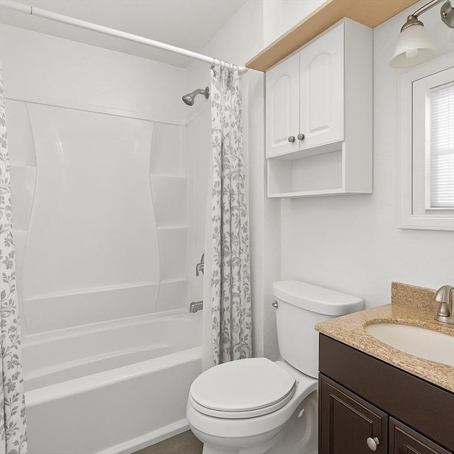 full bath featuring toilet, shower / bath combo, and vanity