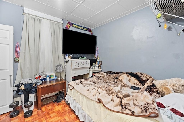 bedroom featuring a paneled ceiling