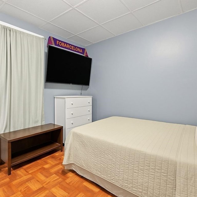 bedroom with a paneled ceiling