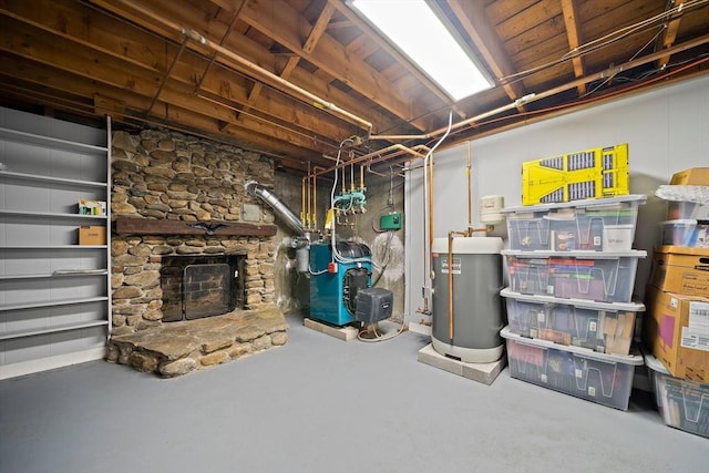 unfinished basement with a heating unit, a stone fireplace, and gas water heater