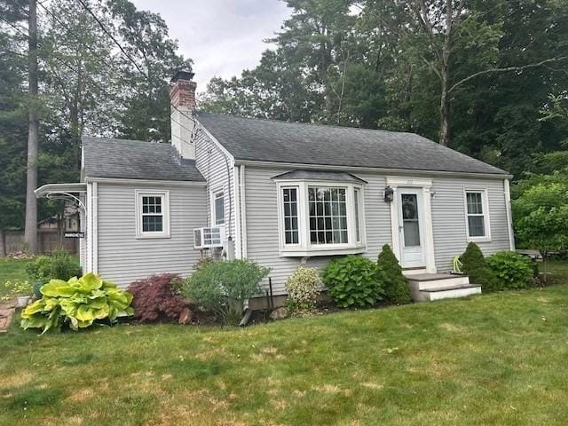211 Parker St, East Longmeadow, MA 01028 - view of front facade featuring a chimney and a front yard