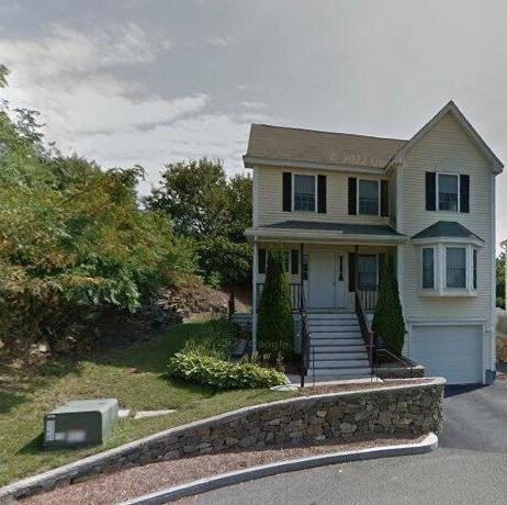 21 Parlee St, Salem, MA 01970 - view of front of house with stairway, driveway, an attached garage, and covered porch