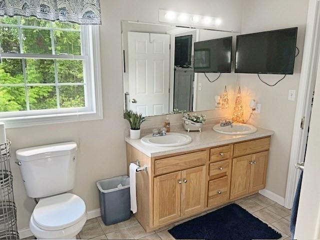 21 Parlee St, Salem, MA 01970 - bathroom featuring double vanity, plenty of natural light, and tile patterned flooring