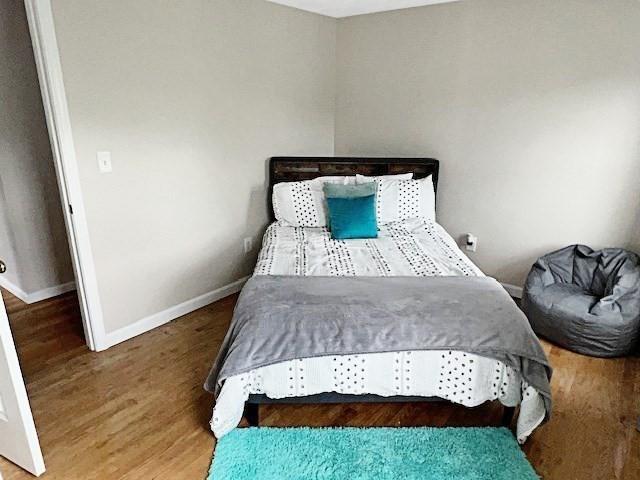 21 Parlee St, Salem, MA 01970 - bedroom featuring baseboards and wood finished floors