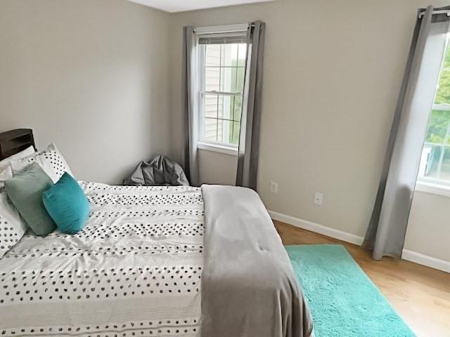 21 Parlee St, Salem, MA 01970 - bedroom featuring multiple windows and light wood-style floors