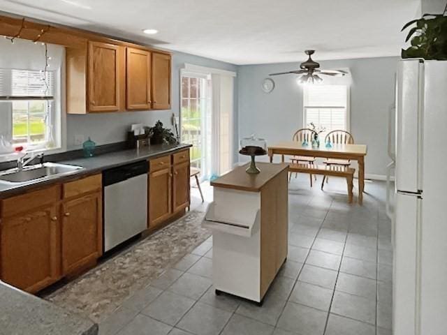 21 Parlee St, Salem, MA 01970 - kitchen with dishwasher, freestanding refrigerator, and plenty of natural light