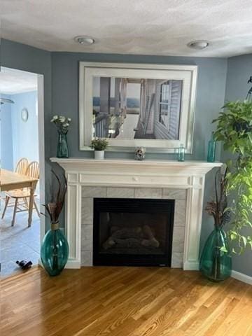 21 Parlee St, Salem, MA 01970 - detailed view of a tile fireplace and wood finished floors