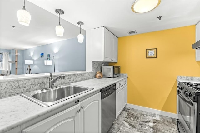 15 N Beacon Unit Ul01, Boston, MA 02134 - kitchen with stainless steel appliances, white cabinetry, light countertops, decorative light fixtures, and light marble finish floors