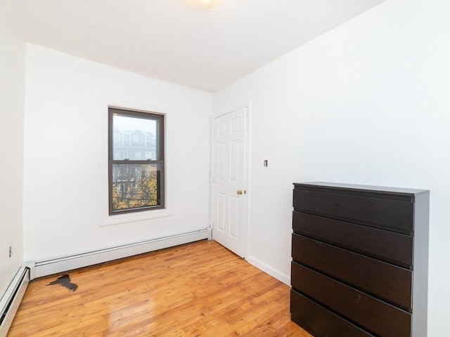 187 W 5th St, Boston, MA 02127 - unfurnished room with light wood-style flooring and a baseboard heating unit