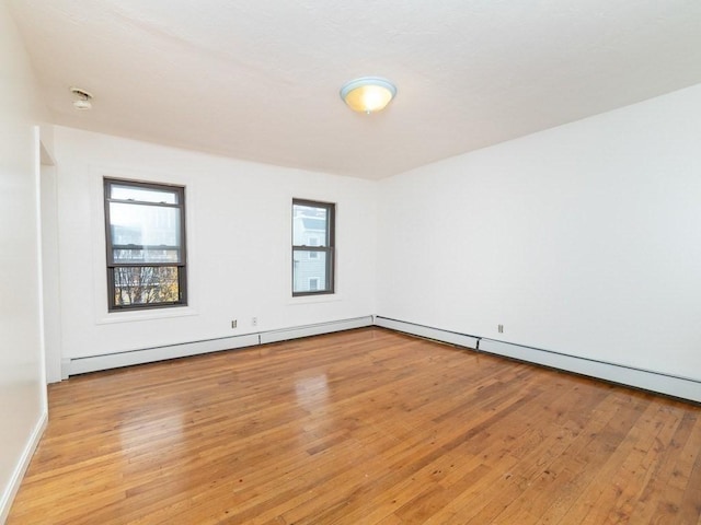 187 W 5th St, Boston, MA 02127 - empty room featuring light wood-style flooring and healthy amount of natural light