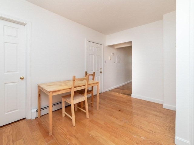 187 W 5th St, Boston, MA 02127 - dining space featuring light wood finished floors and a baseboard heating unit