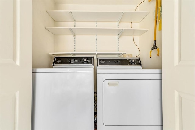 laundry room featuring separate washer and dryer