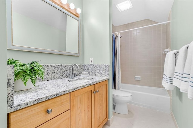 full bathroom featuring tile patterned floors, shower / bathtub combination with curtain, vanity, and toilet