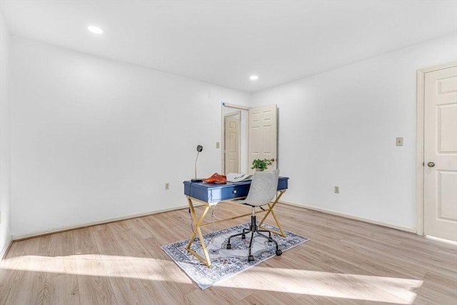 office with light hardwood / wood-style floors