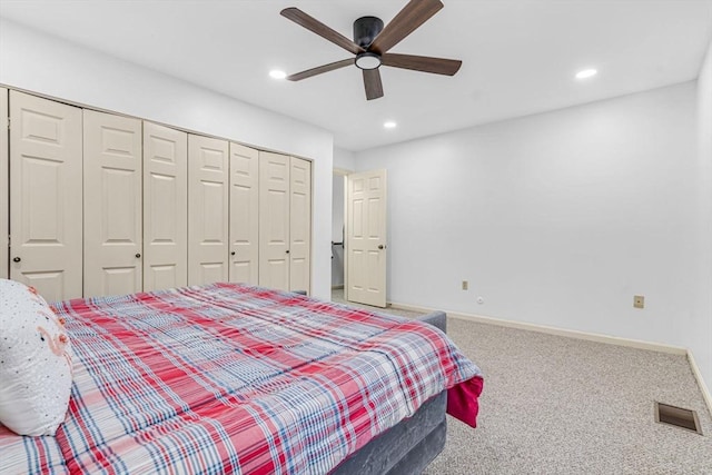 bedroom featuring carpet floors, a closet, and ceiling fan