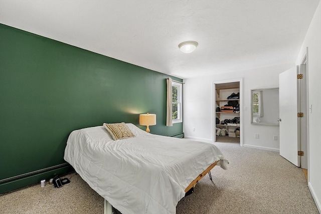 525 Flat Hill Rd, Lunenburg, MA 01462 - bedroom with baseboards, a spacious closet, and carpet