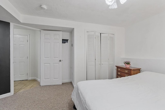 525 Flat Hill Rd, Lunenburg, MA 01462 - bedroom featuring carpet, a closet, baseboards, and tile patterned flooring