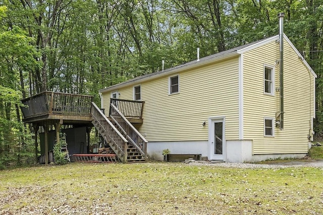 525 Flat Hill Rd, Lunenburg, MA 01462 - back of property featuring stairs, a deck, a yard, and view of scattered trees