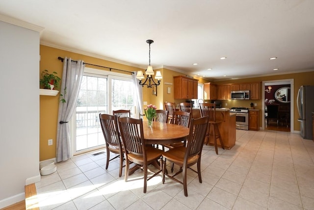 tiled dining area with ornamental molding and an inviting chandelier