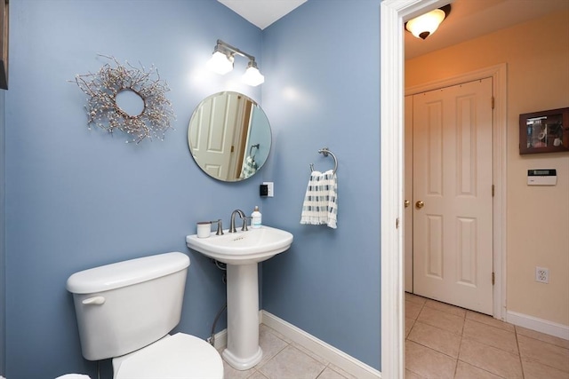 bathroom with tile patterned floors and toilet