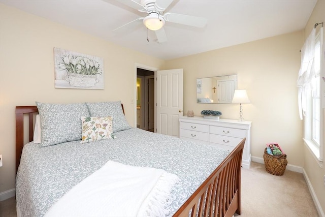 bedroom with light carpet and ceiling fan