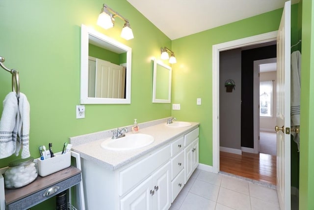 bathroom with tile patterned floors and vanity