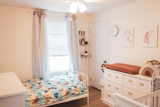 bedroom with light wood-style flooring and ceiling fan