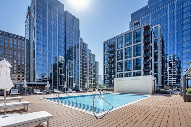 view of swimming pool with a patio