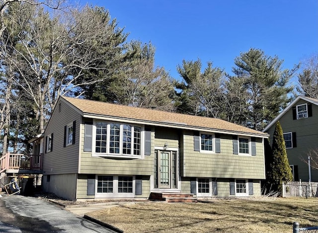 raised ranch with roof with shingles