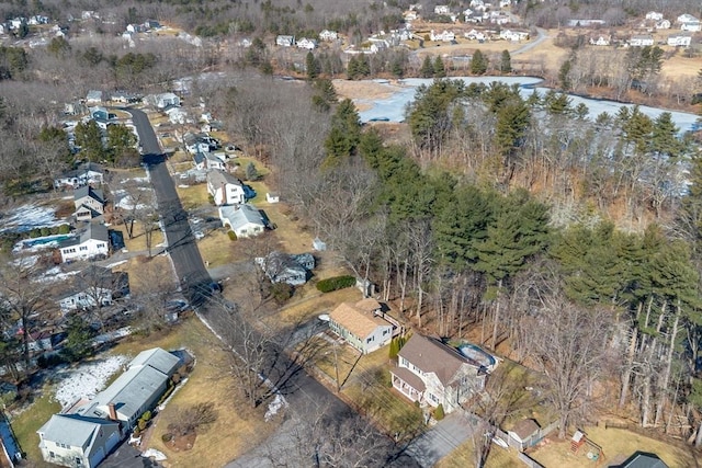 drone / aerial view featuring a residential view and a water view