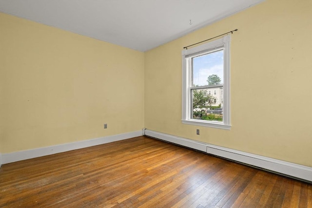 27 Chilcott Pl Unit 2, Boston, MA 02130 - spare room with a baseboard radiator, plenty of natural light, hardwood / wood-style flooring, and baseboards
