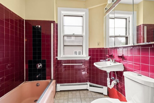 27 Chilcott Pl Unit 2, Boston, MA 02130 - bathroom with toilet, healthy amount of natural light, tile walls, a wainscoted wall, and shower / bathtub combination