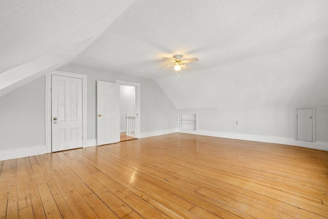 27 Chilcott Pl Unit 2, Boston, MA 02130 - bonus room featuring lofted ceiling, a textured ceiling, ceiling fan, light wood-type flooring, and baseboards