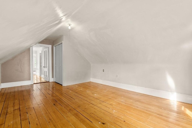 27 Chilcott Pl Unit 2, Boston, MA 02130 - bonus room with hardwood / wood-style flooring, vaulted ceiling, and baseboards