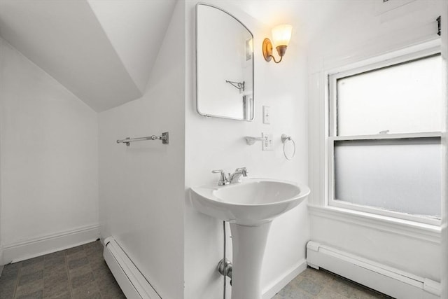 27 Chilcott Pl Unit 2, Boston, MA 02130 - bathroom featuring baseboard heating, vaulted ceiling, baseboards, and tile patterned floors
