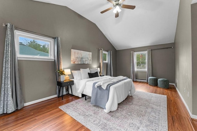 122 Baldwin Ave, Framingham, MA 01701 - bedroom featuring wood finished floors, lofted ceiling, baseboards, ceiling fan, and a baseboard radiator