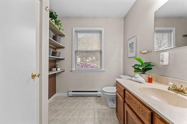 122 Baldwin Ave, Framingham, MA 01701 - bathroom featuring tile patterned flooring, baseboard heating, baseboards, vanity, and toilet