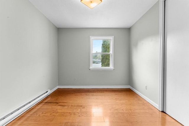 122 Baldwin Ave, Framingham, MA 01701 - unfurnished room with baseboards, baseboard heating, and light wood-type flooring