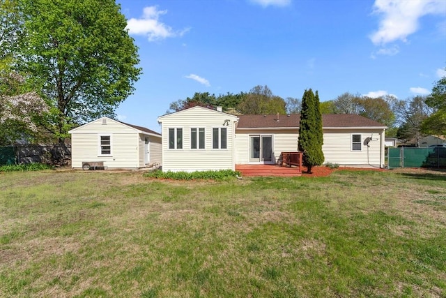122 Baldwin Ave, Framingham, MA 01701 - back of house with fence, a wooden deck, and a lawn