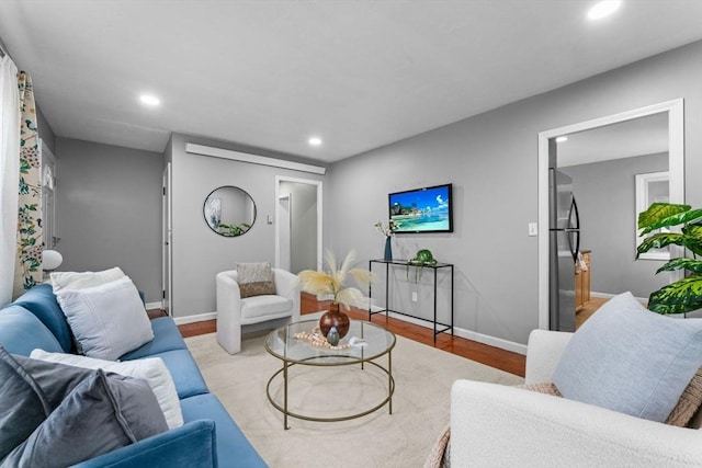 122 Baldwin Ave, Framingham, MA 01701 - living area featuring baseboards, recessed lighting, and wood finished floors