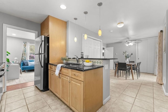 122 Baldwin Ave, Framingham, MA 01701 - kitchen with a sink, freestanding refrigerator, a ceiling fan, light tile patterned floors, and pendant lighting