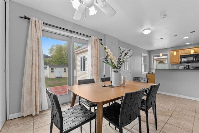122 Baldwin Ave, Framingham, MA 01701 - dining room with light tile patterned floors, baseboards, and a ceiling fan