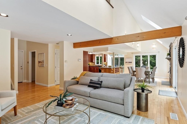 12 Green Needles Rd, Littleton, MA 01460 - living room featuring light wood finished floors, a skylight, recessed lighting, and lofted ceiling