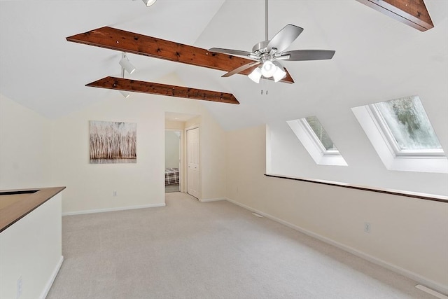 12 Green Needles Rd, Littleton, MA 01460 - unfurnished living room featuring a skylight, light colored carpet, and a ceiling fan