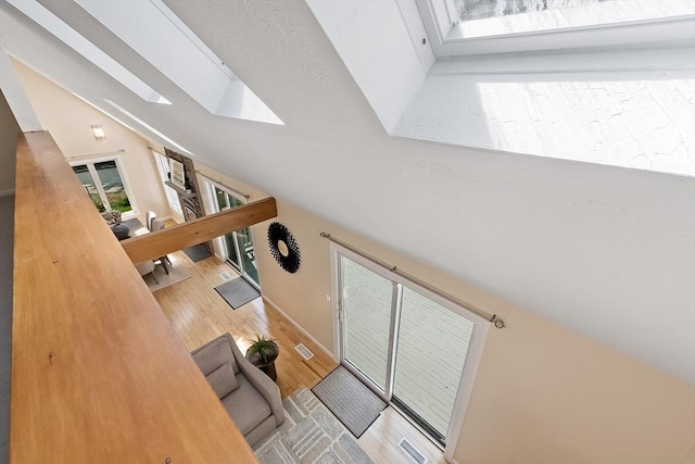 12 Green Needles Rd, Littleton, MA 01460 - living room with a skylight, lofted ceiling, and wood finished floors