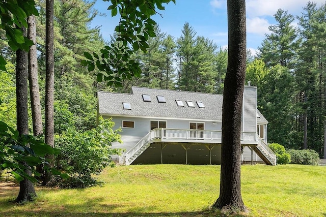12 Green Needles Rd, Littleton, MA 01460 - view of front of house with stairway, a deck, a shingled roof, a front lawn, and a chimney