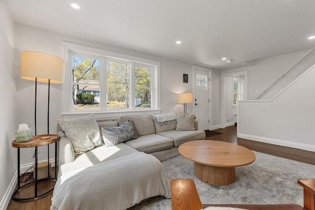 living room featuring stairway, baseboards, recessed lighting, and wood finished floors