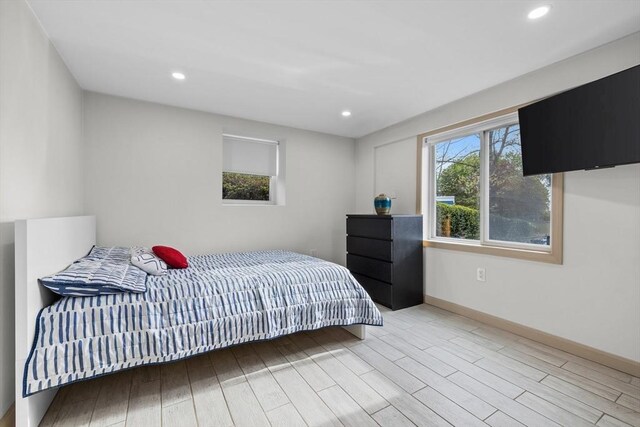 bedroom featuring recessed lighting, baseboards, and light wood-style flooring