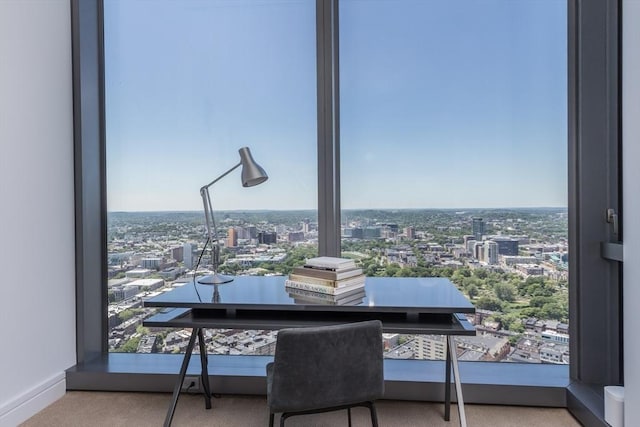 home office featuring carpet flooring and a wealth of natural light